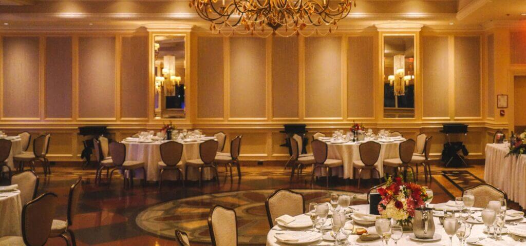 The Murano Room set with round tables around the dance floor