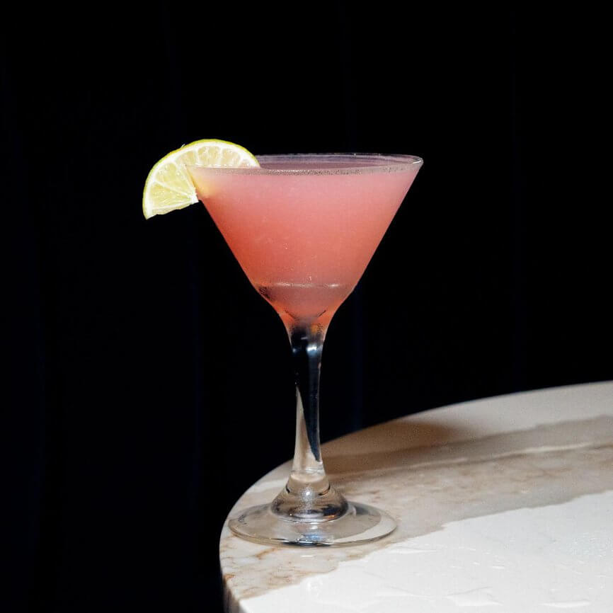 Pink martini with a lime wheel