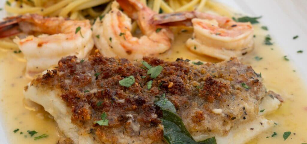 Shrimp over a crumb-topped fillet in lemon butter sauce