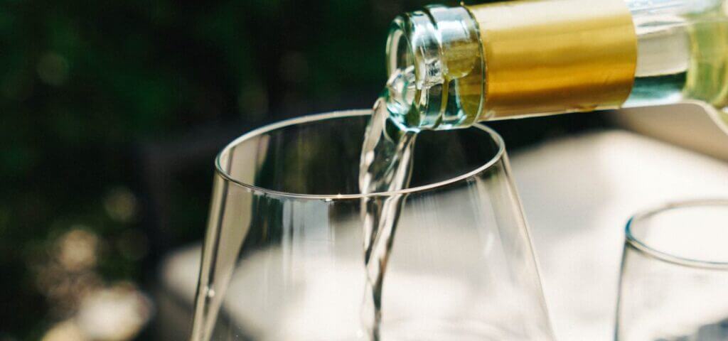 White wine poured into a glass