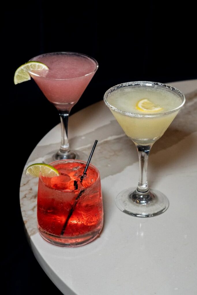 Three colorful cocktails served at Vetro
