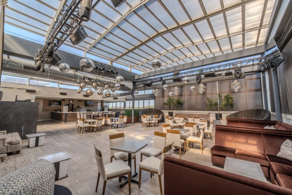 Rooftop Lounge seating beneath the retractable glass roof