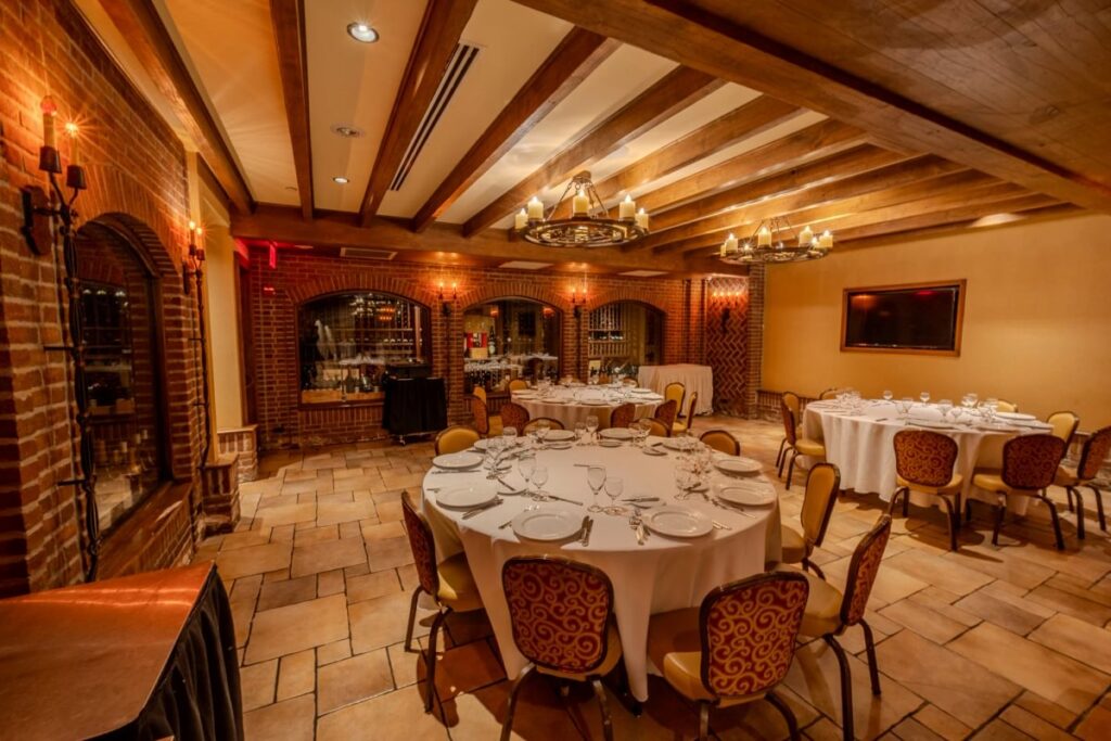Wine Cellar tables beneath timber beams and brick arches